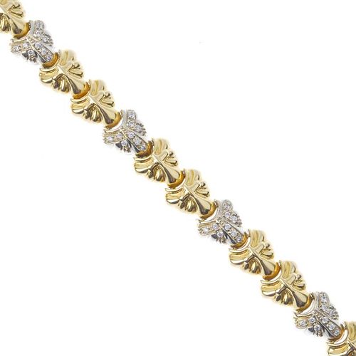 An 18ct gold diamond bracelet. Designed as a series of grooved panels, with four pave-set diamond pa