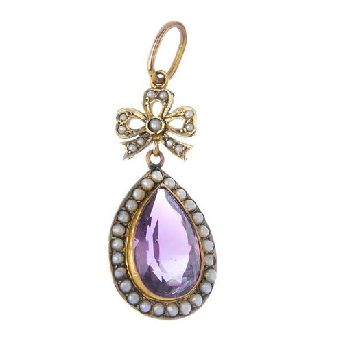 An early 20th century gold amethyst and split pearl pendant. The seed pearl bow, suspending a pear-s