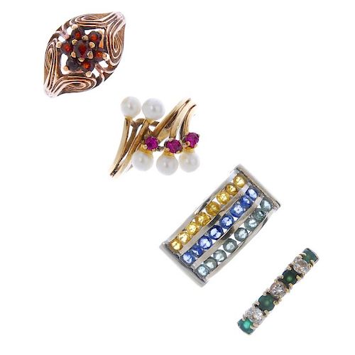 Four gem-set rings. To include a 9ct gold blue, yellow and green sapphire three row ring, a 9ct gold