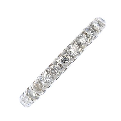 A diamond full-circle eternity ring. Designed as a series of brilliant-cut diamonds, each within a c