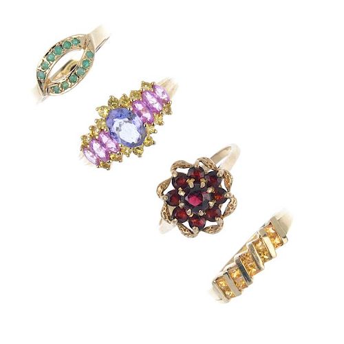 A selection of four 9ct gold gem-set rings. To include an emerald openwork ring, a citrine ring, tog