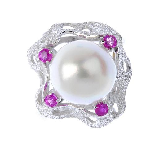 A cultured pearl and sapphire dress ring. he cultured pearl, to the textured undulating surround, wi