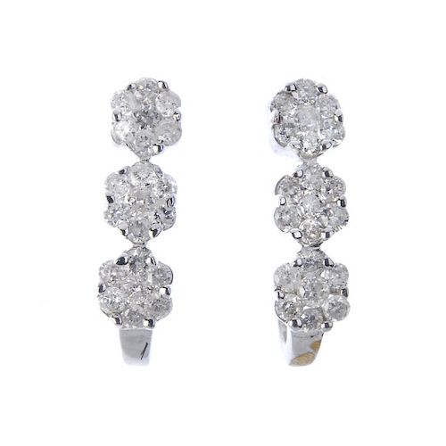 A pair of diamond floral earrings and pendant. To include a pair of diamond earrings, each designed