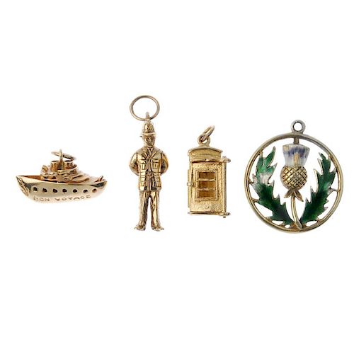 A pendant and three charms. To include a 9ct gold enamel thistle pendant, a 9ct gold policeman charm