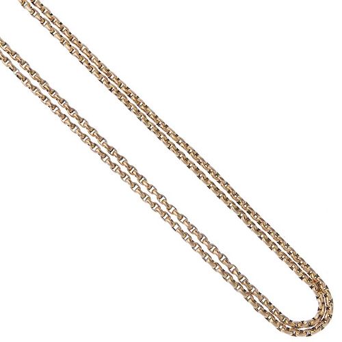 An early 20th century 9ct gold longuard chain. The faceted belcher-link chain, with lobster claw cla
