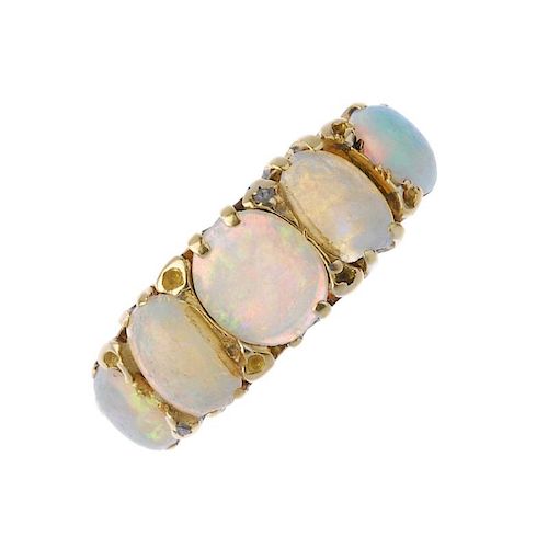 An early 20th century 18ct gold opal five-stone ring. The graduated oval opal cabochon line, to the