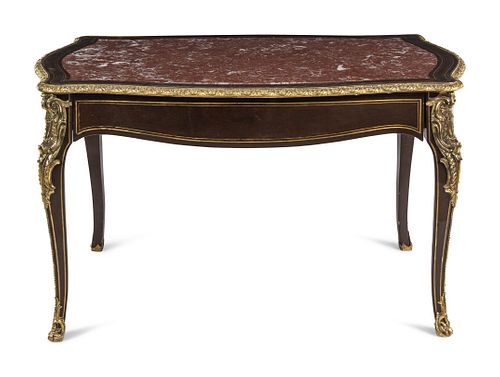 A Napoleon III Gilt Bronze Mounted Ebonized Marble-Top Center Table