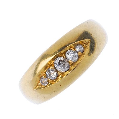 A mid-Victorian 22ct gold diamond five-stone ring. The graduated old-cut diamond line, inset to the