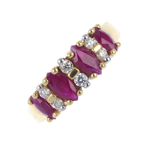An 18ct gold ruby and diamond dress ring. The graduated marquise-shape ruby line with brilliant-cut