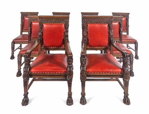 A Set of Eight R.J. Horner Carved Oak Man of the Mountain Dining Chairs