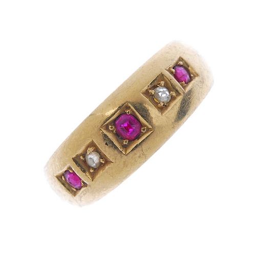 A Victorian 18ct gold ruby and diamond five-stone ring. The circular-shape ruby and single-cut diamo