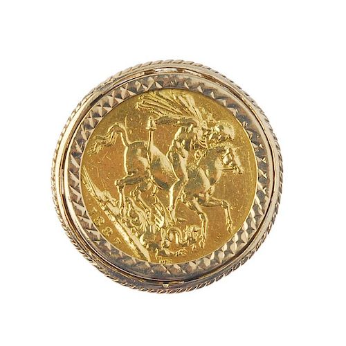 An 18ct gold full sovereign ring. The sovereign, dated 1887, within a a later 9ct gold chevron mount