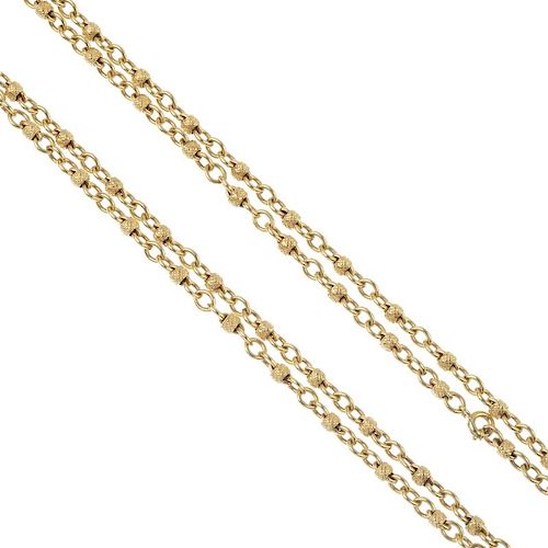 A fancy-link necklace. The belcher-link chain, with textured cylindrical link accents. Length 82cms.