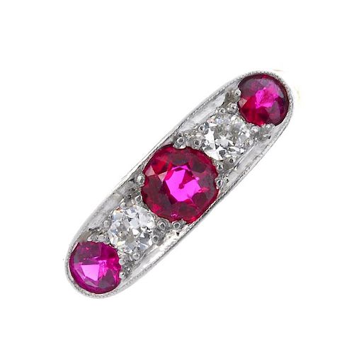 A mid 20th century 18ct gold synthetic ruby and diamond five-stone ring. The circular-shape rubies,