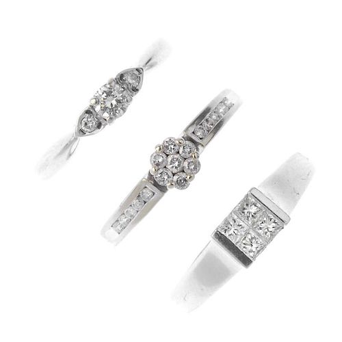 Three 9ct gold diamond dress rings. To include a brilliant-cut diamond three-stone ring, a square-sh