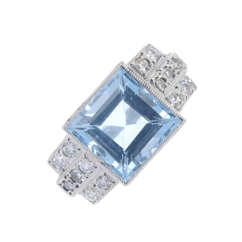 An aquamarine and diamond dress ring. The square-shape aquamarine collet, to the single-cut diamond
