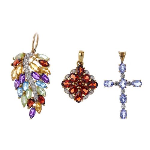 A selection of diamond and gem-set pendants. To include a vari-shape garnet and diamond cluster pend