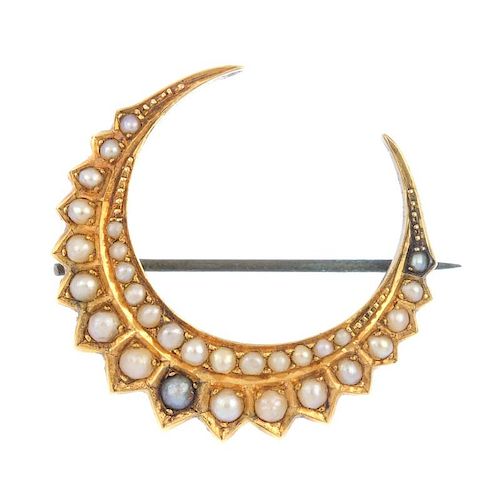 A late 19th century 18ct gold split pearl crescent brooch. Comprising two graduated split pearl cres