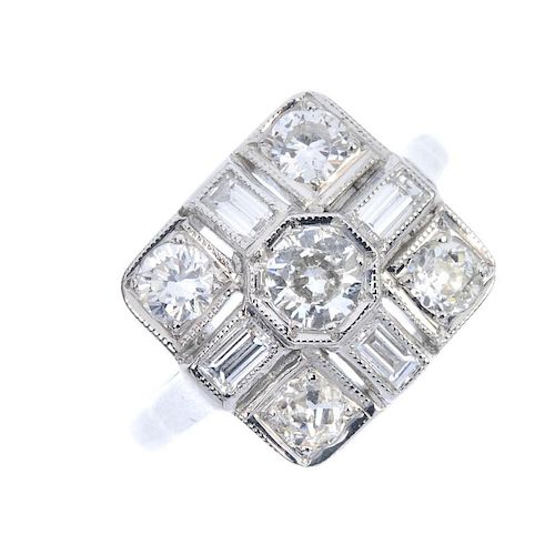 A diamond dress ring. The old-cut diamond collet, within an alternating baguette and old-cut diamond