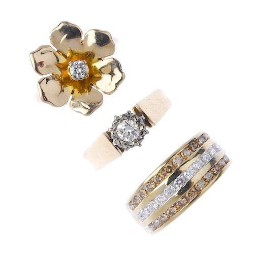 A selection of three 9ct gold diamond rings. To include a brilliant-cut diamond floral dress ring, a