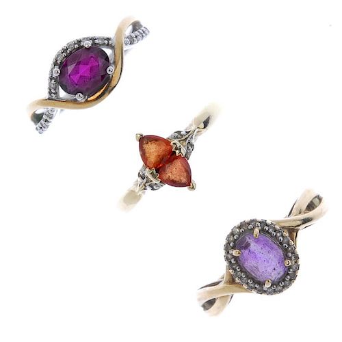 A selection of three diamond and gem-set rings. To include an amethyst and diamond cluster ring, an