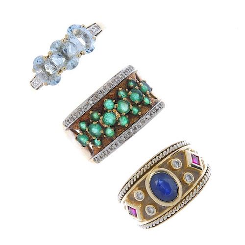 A selection of three gem-set rings. To include a 9ct gold emerald and diamond band ring, a sapphire,
