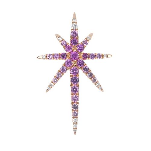 * A sapphire and diamond star pendant. The circular-shape vari-shade pink sapphire star, with brilli