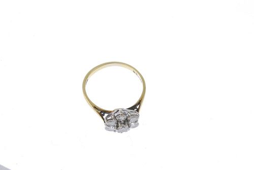 An 18ct gold diamond cluster ring. The brilliant-cut diamond floral cluster, to the tapered band. Es