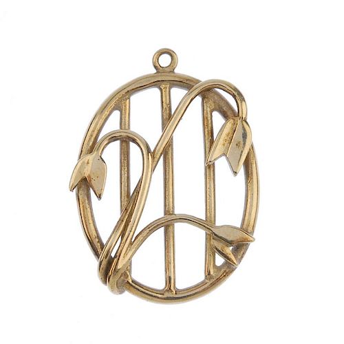 A 9ct gold pendant. Of oval outline, the openwork panel, with floral detail overlay. Hallmarks for E