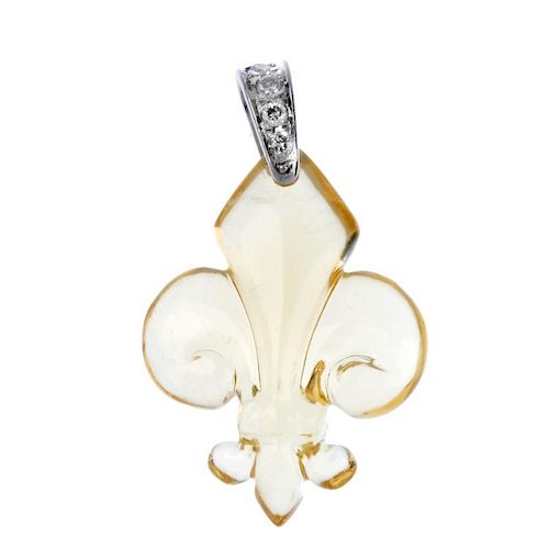 A citrine and diamond pendant. The carved citrine fleur-de-lys, to the brilliant-cut diamond tapered