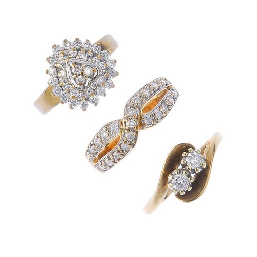 A selection of three 9ct gold diamond rings. To include a brilliant-cut diamond two-stone crossover