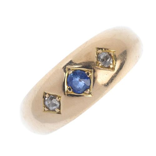 A late Victorian 18ct gold sapphire and diamond three-stone ring. The cushion-shape sapphire and old