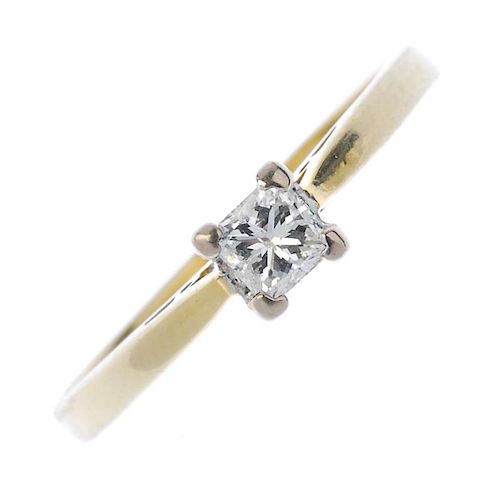 An 18ct gold diamond single-stone ring. The square-shape diamond, to the tapered shoulders and plain