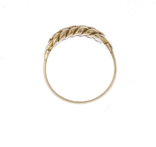 <p>An Edwardian 18ct gold keeper ring. Of interwoven design, with bead accents, to the plain band. H