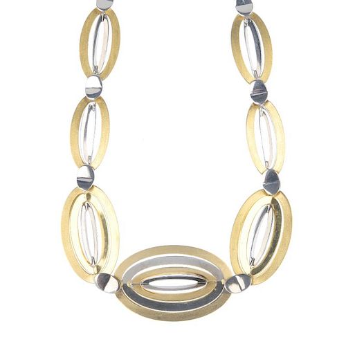 A set of jewellery. The necklace designed as a bi-colour series of graduated oval-shape vari-texture