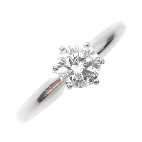 A 14ct gold diamond single-stone ring. The brilliant-cut diamond, to the plain band. Estimated diamo