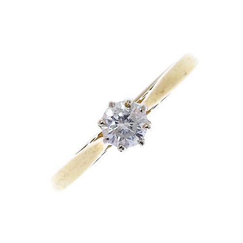 An 18ct gold diamond single-stone ring. The brilliant-cut diamond, to the tapered shoulders and plai