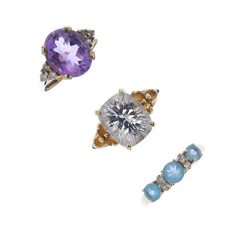 A selection of three 9ct gold gem-set dress rings. To include an amethyst ring with cubic zirconia t