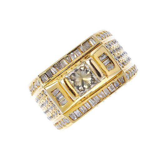 A gentleman's 18ct gold diamond ring. The square-shape diamond, within a baguette-cut diamond surrou
