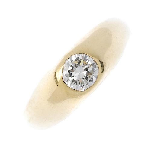A gentleman's 18ct gold diamond single-stone ring. The brilliant-cut diamond, to the tapered shoulde