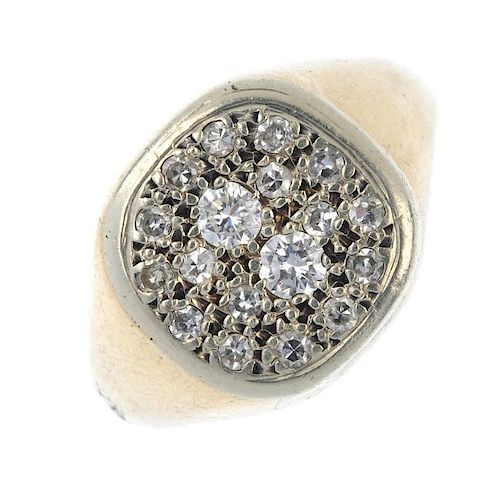 A 9ct gold diamond signet ring. The pave-set diamond curved rectangular-shape panel, to the tapered