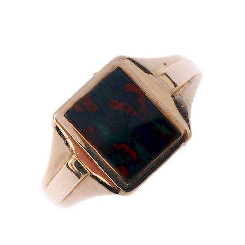 A gentleman's 1960s 9ct gold bloodstone signet ring. The rectangular-shape bloodstone, to the tapere