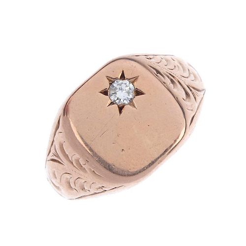 A 9ct gold diamond signet ring. The square-shape panel, with brilliant-cut diamond star highlight, t