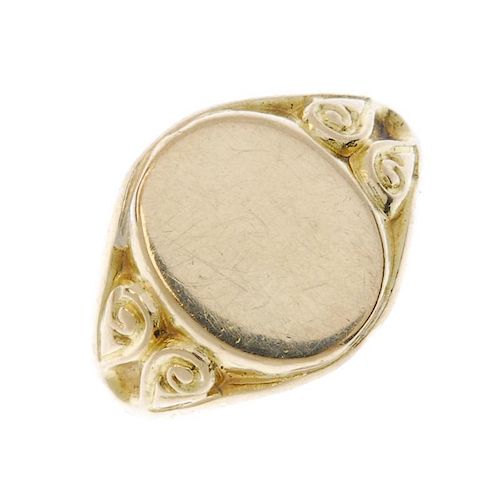 A gentleman's early 20th century 18ct gold signet ring. The oval-shape panel to the scrolling sides.