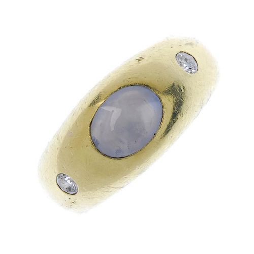 A gentleman's sapphire and diamond three-stone band ring. The oval bluish grey sapphire cabochon, to