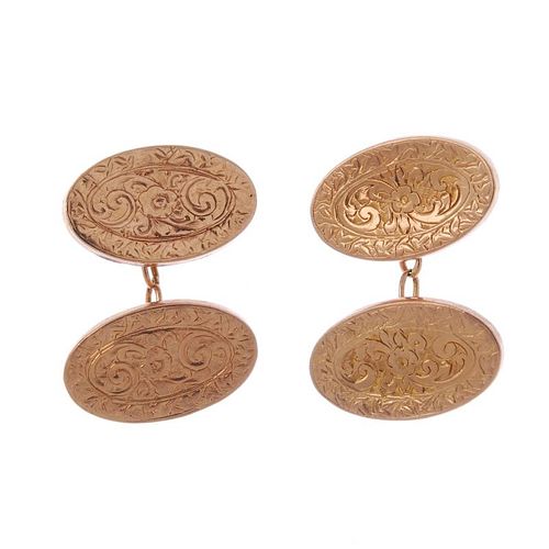 Two pairs of 9ct gold cufflinks. To include a pair of early 20th century oval-shape scroll engraved