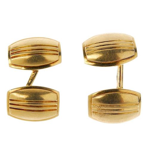 A pair of mid 20th century cufflinks. Each designed as a curved panel with grooved highlights, to th