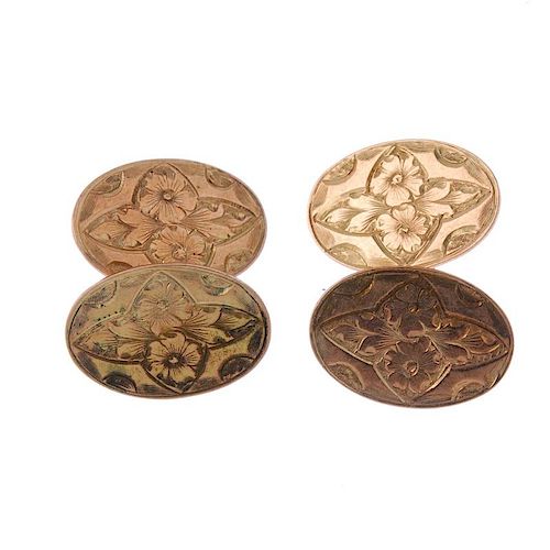 A pair of early 20th century 9ct gold cufflinks. Each designed as two oval-shape foliate panels, con