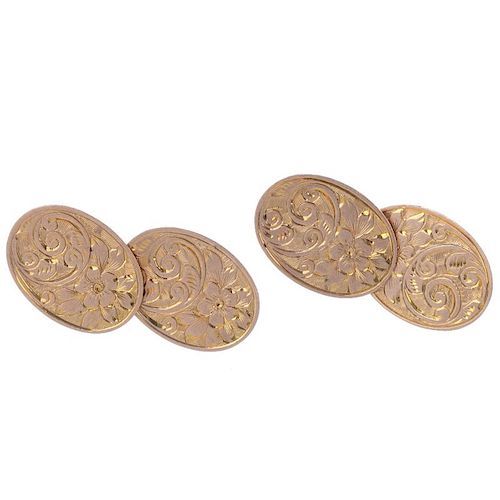Two pairs of early 20th century 9ct gold cufflinks. To include a pair of oval-shape scroll engraved