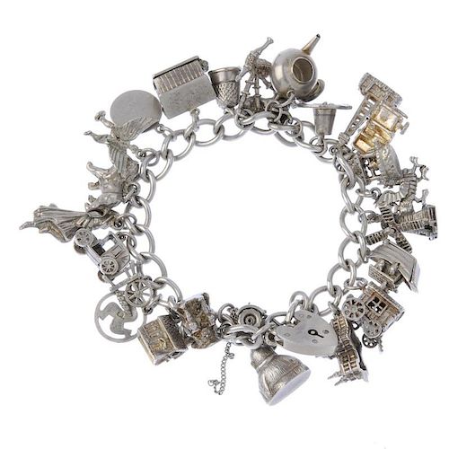 A selection of silver charm bracelets. To include four curb-link chains suspending a total of ninety